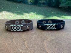 Black or Brown leather bracelet with a silver double infinity . The band is 5/8" wide with a two position snap closure & will fit a wrist that measures 6-1/2" - 7-1/2". Please check measurements for a comfortable fit. Can be made in different size if requested. ' Adjustable Silver Double Band Leather Bracelet, Adjustable Double Band Silver Leather Bracelet, Silver Adjustable Double Band Leather Bracelet, Silver Double Band Adjustable Leather Bracelet, Adjustable Nickel-free Black Leather Bracelet, Adjustable Black Nickel-free Cuff Bracelet, Adjustable Black Nickel-free Leather Bracelet, Double Infinity, Brown Leather Bracelet