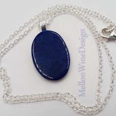 I kept the design simple, using only sterling silver chain and components, letting the beauty of this small oval Lapis stone be the focal. Necklace Details: - Dainty Sterling Silver Oval Chain and Components  - Oval Lapis Lazuli stone L: 0.75 in  W: 0.50 in - Necklace Length is 18 inches - Ships the next business day Lapis Lazuli quickly releases stress, bringing deep peace. Lapis stimulates the desire for knowledge and aids the process of learning. It is excellent for enhancing memory.  Handmad Oval Pendant Jewelry With Large Stone For Gift, Gift Necklace With Large Oval Stone, Oval Necklace With Large Stone For Gifts, Large Stone Oval Pendant Necklace For Gifts, Oval Pendant Necklace With Large Stone For Gift, Handmade Oval Lapis Lazuli Necklace, Sterling Silver Necklace With Large Oval Stone, Classic Sterling Silver Necklace With Oval Cabochon, Oval Sterling Silver Necklace With Large Stone