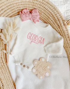 Introducing our Personalized Chunky Knit Oversized Sweater, a perfect blend of warmth and style for your little bundle of joy.  This sweater holds your little one in softness, ensuring snug comfort during chilly days. What sets it apart is the personal touch - a beautifully embroidered personalized name that adds a special charm to this already adorable piece.  Embrace the warmth and cherish the memories with this unique, customized sweater.  The perfect addition for your little addition.  Use i Baby Name Sweater Pictures, Personalized Baby Sweater, Personalized White Sweater For Winter, Personalized Pink Crew Neck Sweater, Personalized Pink Long Sleeve Sweater, Personalized Pink Sweater For Winter, Customizable Cute Winter Sweater, Cute Customizable Winter Sweater, Personalized Cute Crew Neck Sweater