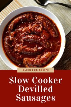 slow cooker deviled sausages in a bowl on a wooden table with a spoon