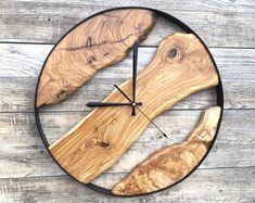 a clock made out of wood on top of a wooden table