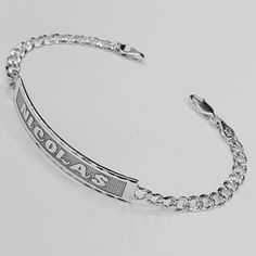 "Laser Deep Engraved.   Bracelet Script engraved.  Metal: Solid 925 Sterling Silver.  Chain type Bracelet: Curb Chain Diamond Cut.   Clasp Link: Lobster Claw lock.  Bracelet Chain Thickness: 4.8 mm.  ID Bar:  44 mm Wide X 8mm Hight. (Default) (Front: Max Font cursive script: 9 Letters.)        Deep Engraved ID Bracelet.  we can customize this jewelry bracelet with any name of your  choice and also determine the size of the bracelet in order to ensure that it is perfectly fitted on  your wrist. ( Personalized Gold Bracelet, Font Cursive, Flat Bracelet, Nameplate Bracelet, Nameplate Necklace Silver, Lock Bracelet, Chain Diamond, Cursive Script, Engraved Metal