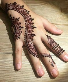 a henna tattoo on someone's hand