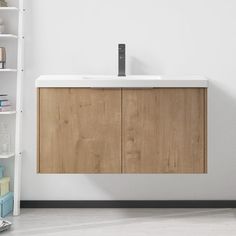 a bathroom with a sink and shelving unit