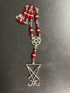 7 3/4" Clear Red Bead Satan's Sigil Car Rosary  Please see photos for more detail  Thanks for Looking 🙂 * penny not included Car Rosary, Red Bead, Prayer Beads, Rosary, Bead Charms, Penny, Beauty Book, Charms, Accessory Gift