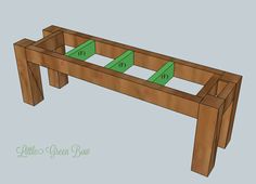 a wooden bench made out of wood with green tape on the top and bottom part