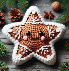 a crocheted christmas star ornament on a wooden table with pine cones