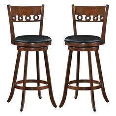 two wooden barstools with black leather seats