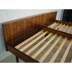 a bed with wooden slats and no sheets