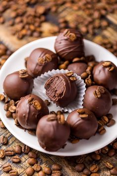 chocolate truffles on a plate with coffee beans