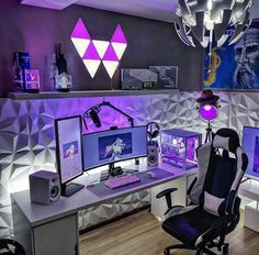 a desk with two computer monitors on it and a chair in front of the monitor