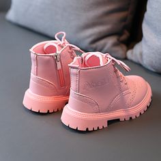 Children's Zipper Leather Boots offer style and added height to your child's outfit! They are classy shoes that have a zipper on the side to help with wear. They come in 3 amazing colors and different sizes to choose from. The details on these boots are fantastic with a dotted stitch design. These boots are a great choice for your child's wear! PRODUCT HIGHLIGHTS: Outsole Material: Rubber Upper Material: PU Gender: Unisex Fit: Fits true to size, take your normal size Season: Spring & Autumn Clos Faux Leather Martin Boots With Zipper Closure, Fall High-top Boots For School, School Boots For Fall With Round Toe, Pink Low-top Leather Boots, Pink Leather Boots With Snip Toe, Leather High-top Moto Boots With Zipper Closure, Toddler Leather Boots, Disney Sneakers, Disney Slippers