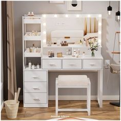 a white vanity with lights on it and a stool in front of the counter top