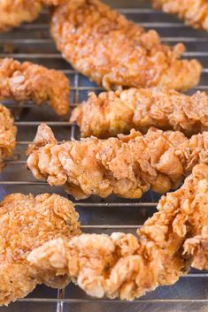 chicken nuggets are being cooked on a grill