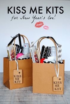 two brown paper bags with kiss me kits on them