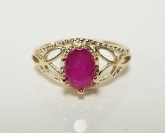 "Thanks for shopping our vintage estate store. We tend to sell well below wholesale and truly hope you enjoy all of our items. Many of the items are one of a kind, so please enjoy scrolling through the pictures and hopefully something will catch your eye. Spots are from reflections or camera. Estate 14k yellow gold natural Serengetti 1ct oval red ruby filigree ring. No scratches on the gem. Stunning. Vintage setting, we added the gem. Size: 6 Setting: 8mm 3/8\" by 6mm 1/4\" Band width: 2mm Weight:  2.63 grams Marked 14k. Gem is stunning." Classic Oval Ruby Ring, Oval Ruby Ring Collectible, Heirloom Oval Ruby Ring For Collectors, Heirloom Oval Ruby Ring Collectible, Vintage Oval Ruby Ring Stamped 14k, Oval Ruby Ring Stamped 14k For Anniversary, Oval Ruby Ring For Anniversary Stamped 14k, Antique Oval Ruby Promise Ring, Vintage Setting