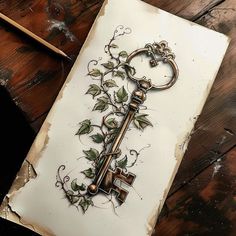 an old key with vines growing out of it on top of a piece of paper