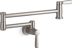 a kitchen faucet with two handles and nozzles in stainless steel finish