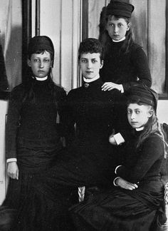 an old black and white photo of four women