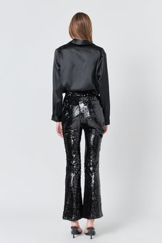 Our Sequin Flare Pants are so much fun, you'll never want to take them off! These sequin pants stand out from others because they feature a mini flare with a front slit. Throw on these pants for any special occasion, just be ready for all of the compliments you're going to get! Sequin High-waisted fit Mini flare with front slit Fits snug Lined Side zipper with hook-and-eye closure Hand wash cold Do not bleach Do not tumble dry Do not iron Shell: 100% Polyester Lining: 100% Polyester Exclusive of Pants Stand, Sequin Flare Pants, Sequin Pants, Be Ready, Flare Pants, Side Zipper, Special Occasion, Bleach, Hand Wash