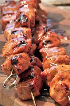 the skewers are covered with meat and sauce