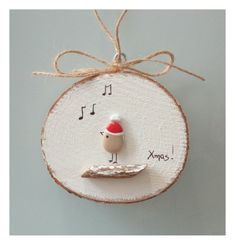 a wooden ornament with a bird and musical notes