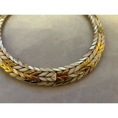 This is part of Chairish’s Costume Jewelry assortment.  A magnificent and weighty gold-tone and white enameled Ciner choker/collar, ca. late 1950s/early 1960s.  This choker belonged to a notable costume jewelry industry professional, who worked for Trifari.  Ciner jewelry was founded in New York City in 1892 as a fine jeweler and this family-owned operation is still in business today!  Since 1931, the company has produced fine costume jewelry. Luxury White Enamel Necklace, Mid-century Gold Enamel Jewelry, Vintage White Enamel Necklaces, Retro White Enamel Jewelry, White Retro Enamel Jewelry, Ciner Jewelry, Chanel Flower, Gold Circle Necklace, Lapis Necklace