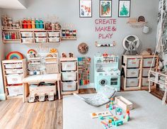 a child's playroom with lots of toys on the floor