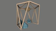 an object that looks like it is in the shape of a cage with two blue balls inside