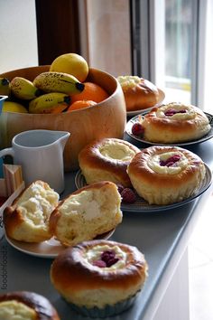 various pastries and fruit are on the table