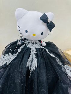 "Bring a touch of elegance to your quinceañera celebration with the custom Hello Kitty last doll. Dressed in a stunning black dress with silver appliques, this gorgeous doll is sure to make a statement. Add a unique and stylish touch to your special day with this beautiful addition to your decor." Custom Hello Kitty, Your Special, Quinceanera, Appliques, Special Day, Black Silver, Hello Kitty, Black Dress, Kitty