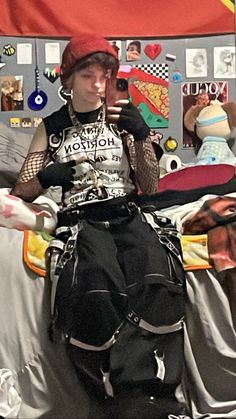 Trans masc guy wearing a bring me the horizon sleeveless shirt with fishnet sleeves, and black tripp pants with reflective straps and chains. Also wearing a red beanie and chains on his neck. Tripp Pants Outfit Men, Trans Ftm Outfit Ideas, Scene Outfit Inspo Masc, Alt Transmasc Outfits, Ftm Summer Outfits, Transmasc Summer Outfits, Transgender Outfits Ftm, Masc Scene Outfits, Emo Transmasc