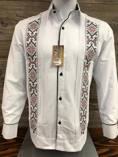 Mexican Guayabera.  Handcrafted in Merida, Yucatan Mexico. Made out of Cotton & Polyester Fabric Blend Red and Black Cross Stitch Embroidery Two Embroidery Panels Long Sleeve.  Beautiful and Elegant Guayabera Shirt.  Traditional Mexican Shirt  Good for Casual wear, Wedding, Fiesta, Tropical, Birthday or any other occasion. 100% Brand New  New Inventory  Please refer to size chart for proper fitment.  We gladly accept returns with these terms and conditions.  We do charge a 25% Fee on any returns. This helps compensate for shipping fees, packing supplies and labor costs.  Exchanges have no cost.  Customer is responsible for shipping items back.  We do not provide prepaid labels.  Items should be returned just as received and with no damages or signs of wear. No returns on Clearance Items. Traditional Long Sleeve Shirt With Intricate Embroidery, Traditional Festive Shirt With Floral Embroidery, Festive Traditional Shirt With Floral Embroidery, Traditional Floral Embroidered Shirt For Festive Occasions, Traditional Long Sleeve Shirt With Patterns, Traditional Long Sleeve Wedding Wear With Woven Motifs, Traditional Wedding Wear With Woven Motifs And Long Sleeves, Traditional White Embroidered Shirt, Traditional Long Sleeve Shirt With Motif