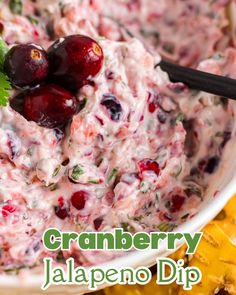 cranberry jalapeno dip in a bowl with chips