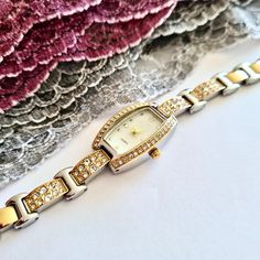 Wrist Watch for Woman, Gold and Silver Colour, Zirconia Stones, Dainty Watch, Easy Usage, Stylish Design, Charismatic Design, Rectangle Design, Pearl Design Dial, Cool Design, Classy Design Total Length: 21 cm Case Diameter: 29 x 17 mm Band Width: 10 mm Case Thickness: 8 mm Weigth: 55 gr Rhinestone Watches With Round Dial, Rhinestone Watches Perfect As Gifts, Stainless Steel Watches With Rhinestones For Gifts, Pearl Design, Gold And Silver, Womens Watches, Silver Color, Wrist Watch, Jewelry Watches