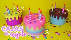 three colorful birthday cakes with candles on them