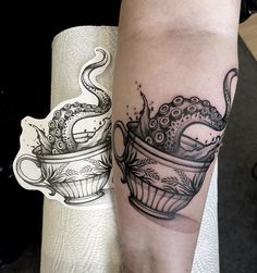 a woman with a tattoo on her arm has a cup and an octopus in it