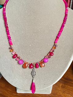 This bright and sassy summer necklace is packed with pink and orange gemstones, both sterling silver and 14k gold filled components, measures approx 19 inches, bold summer fashion statement with aaa luxe gemstone briolettes.  Gemstones include: Chalcedony Sunstone Quartz Sapphire Tourmaline Topaz Pink Bohemian Single Strand Necklace, Vibrant Pink Handmade Jewelry, Pink Bohemian Jewelry With Faceted Beads, Bohemian Pink Jewelry With Faceted Beads, Bohemian Pink Gemstone Bead Necklaces, Vibrant Pink Jewelry For Gift, Vibrant Pink Jewelry Gift, Luxe Jewelry, Summer Necklace