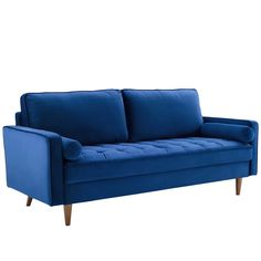 a blue couch sitting on top of a white floor