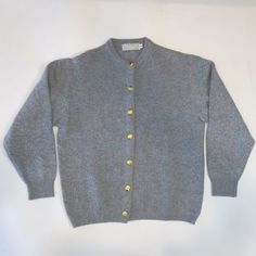 Archie Brown & Sons Gray Lambswool Angora Blend Cardigan Sweater -Gold Tone Seashell Buttons Womens' Size 44 - PLEASE SEE MEASUREMENTS TO ENSURE PROPER FIT  In great preowned condition - gently worn, no flaws - please see photos.   Please let me know if you have any questions or would like to see additional photos before buying.  Customer service is very important to me and I want to make sure you are happy with your purchase.  Thank you! Classic Gray Long Sleeve Cardigan, Classic Gray Wool Cardigan, Classic Gray Cardigan For Fall, Vintage Winter Workwear Cardigan, Classic Gray Cardigan With Buttons, Classic Gray Sweater With Button Closure, Classic Crew Neck Cardigan With Buttons, Classic Knit Cardigan, Vintage Long Sleeve Cardigan For Work