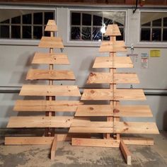 three wooden christmas trees sitting on top of each other