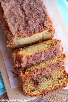 sliced loaf of banana bread sitting on top of a cutting board