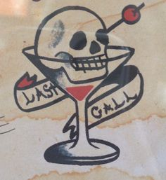 a drawing of a skull holding a martini glass with the word just chill on it