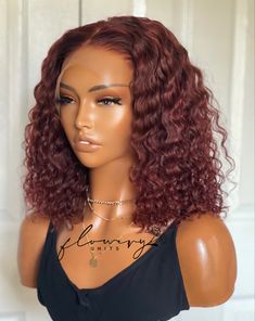 Image of a brown mannequin wearing a cherry wine colored wavy bob length wig. The wig is a glueless handcrafted frontal wig that has combs and an adjustable elastic band attached. This wig was made by Flowery Units, a black woman owned business. Lace Closure Bob, Indian Remy Human Hair, Curly Bob Wigs, Open Hairstyles, Curly Bob, Brazilian Human Hair