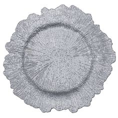 a clear glass plate with scalloped designs on the rim and bottom, set against a white background