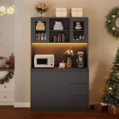 the kitchen is decorated for christmas with lights and decorations on the shelves, along with a microwave