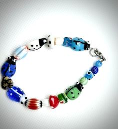 "\"Bugs life\" multicolored beaded bracelet-Adult size" Casual Multicolor Beaded Jewelry, Adjustable Multicolor Casual Beads, Colorful Adjustable Casual Beads, Casual Multicolor Bracelet Jewelry, Casual Colorful Beaded Jewelry, Adjustable Large Multicolor Beads, Multicolor Stretch Bracelet With Polished Beads, Multicolor Polished Beads Stretch Bracelet As Gift, Multicolor Stretch Bracelet With Polished Beads As Gift