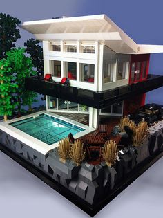 a lego model of a house with a swimming pool