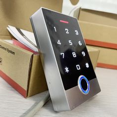 an electronic keypad sitting on top of boxes