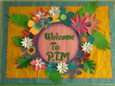 a welcome to pm sign with flowers and leaves on yellow paper sheeted wallpaper